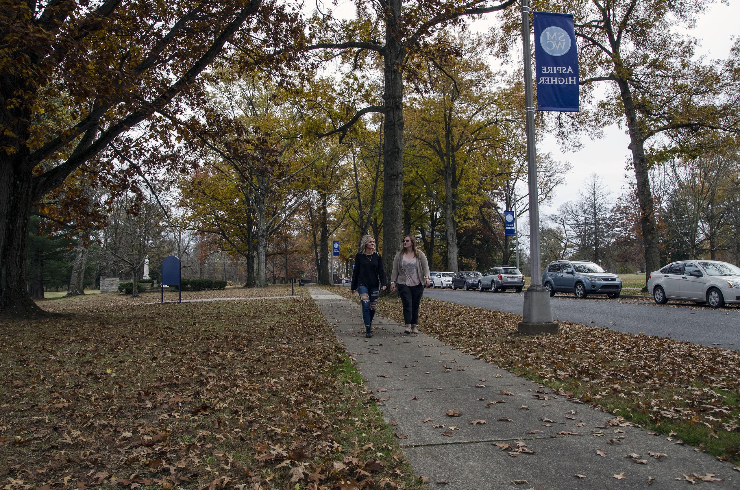 Two students walking down the Avenue